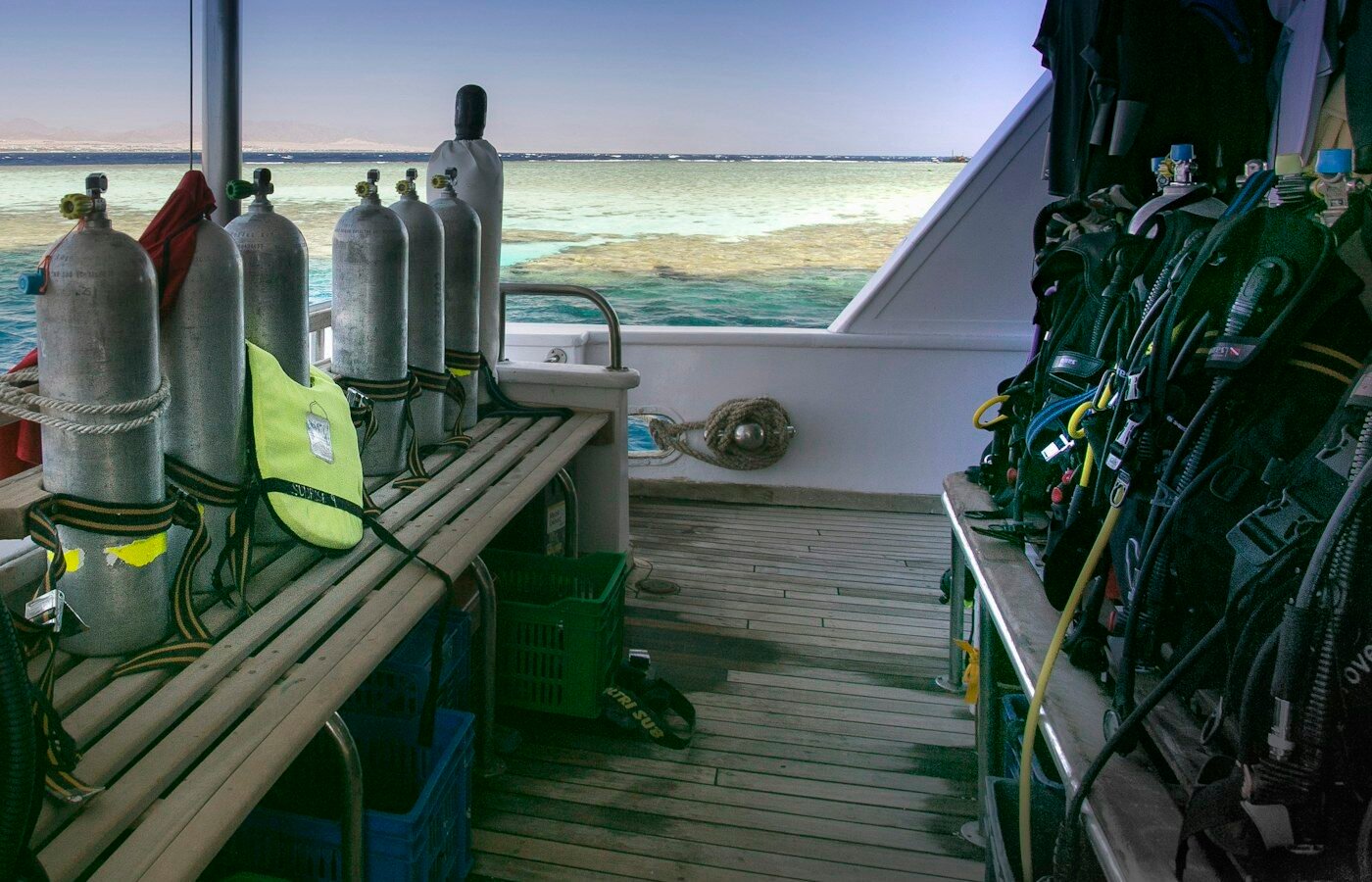 Scuba diving equipment arranged on a boat deck